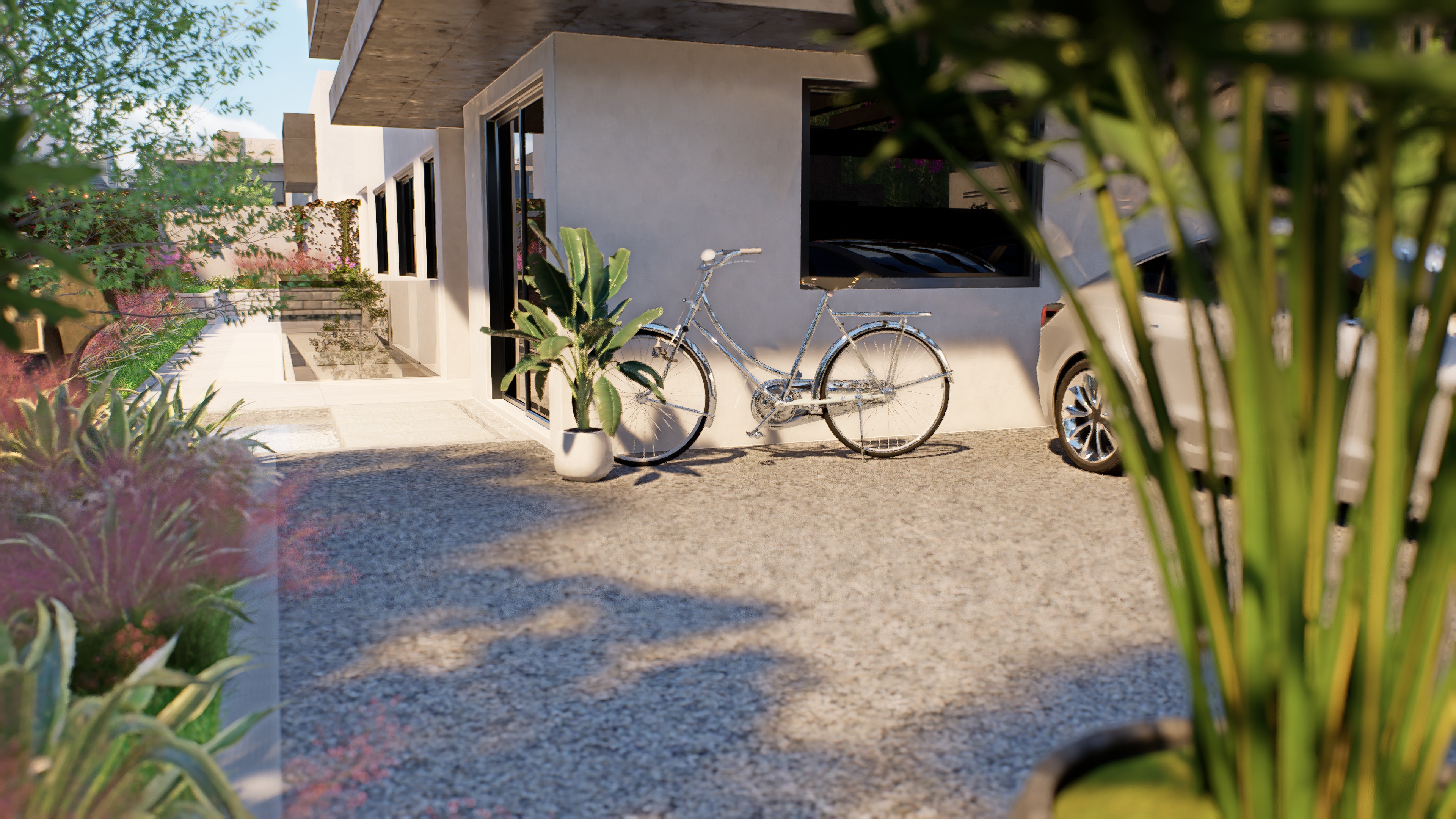 Entrada exterior de Valentia con garaje moderno, bicicleta vintage y exuberante paisajismo con plantas tropicales