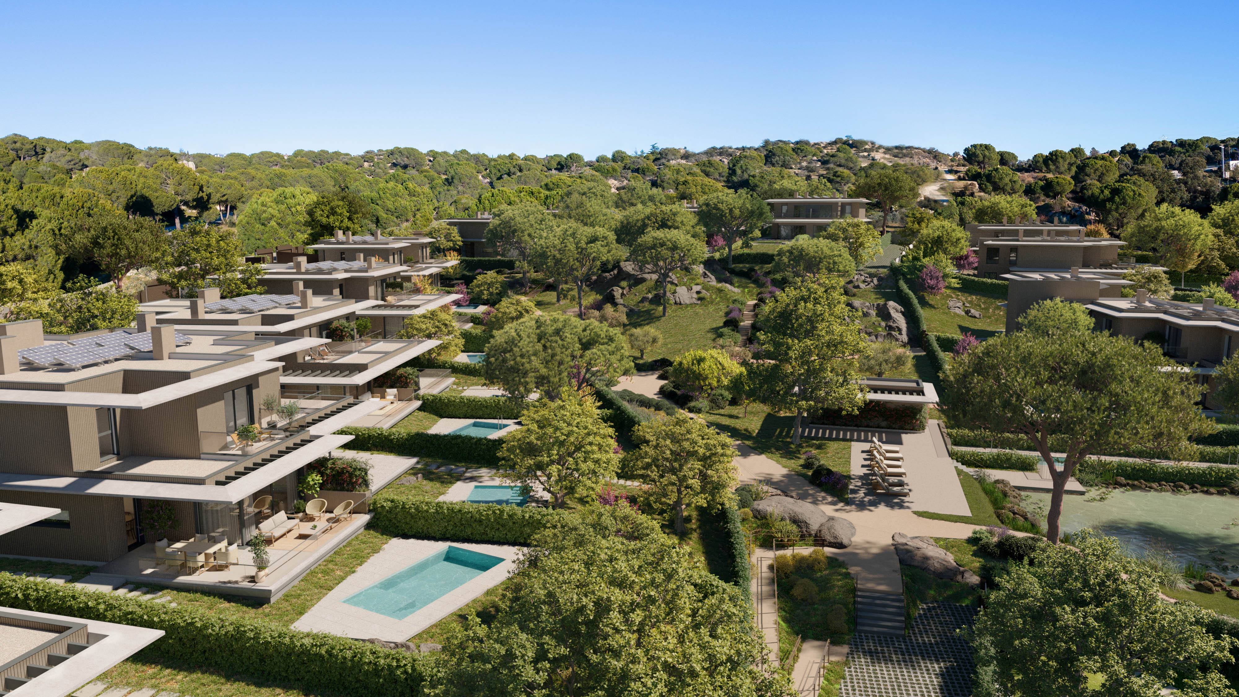 Vista aérea del complejo residencial Natura Torrelodones con viviendas integradas en el paisaje natural