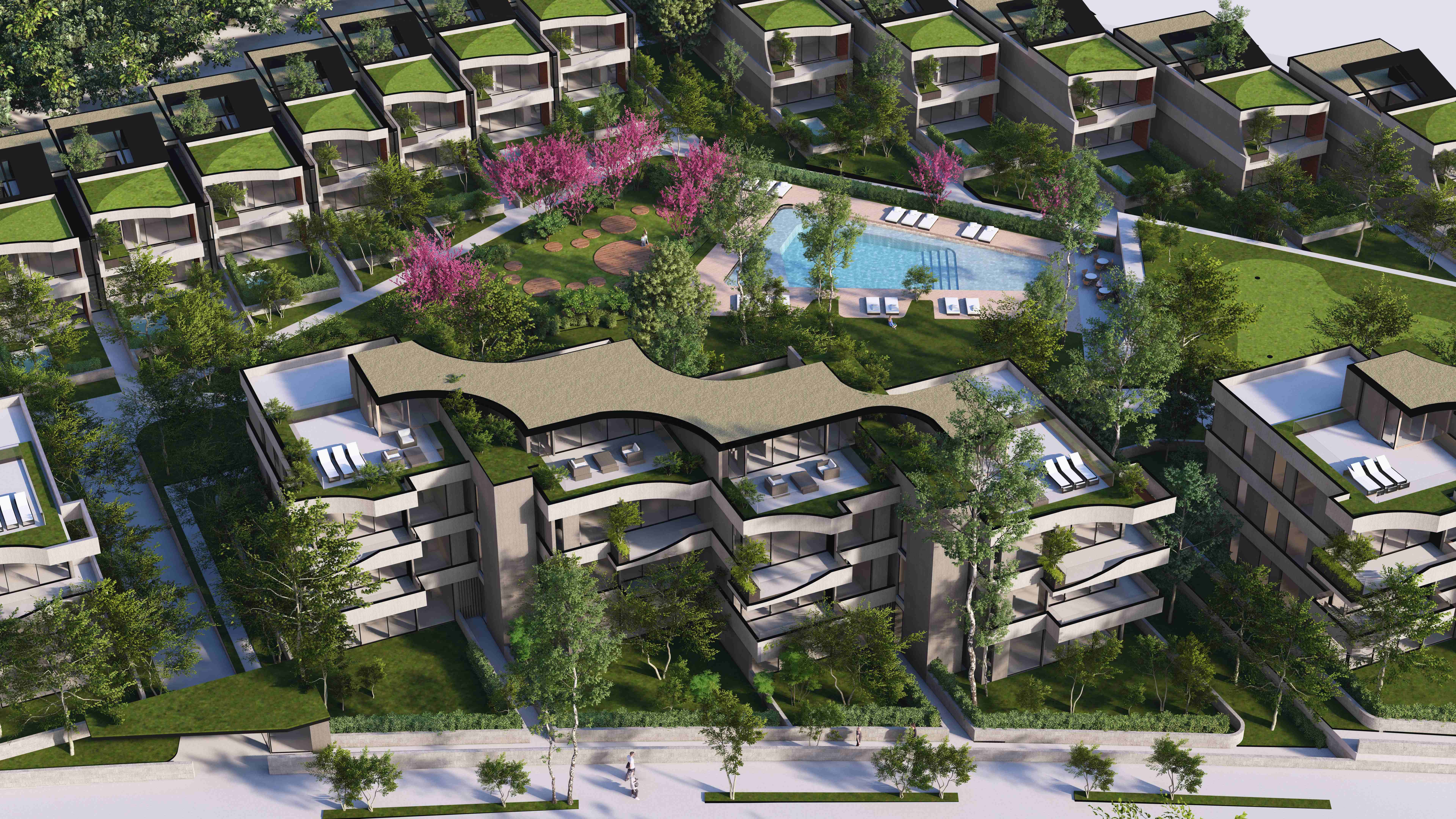 Vista aérea de la urbanización Mirage con zonas verdes, piscina y viviendas